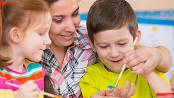 teacher painting with students